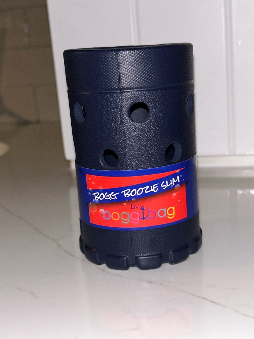 Bogg Bag Boozie Slim is a navy blue,NWT